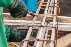 Close up worker tying steel in the construction site