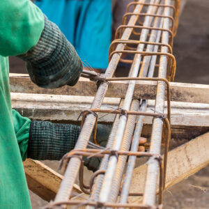 Close up worker tying steel in the construction site